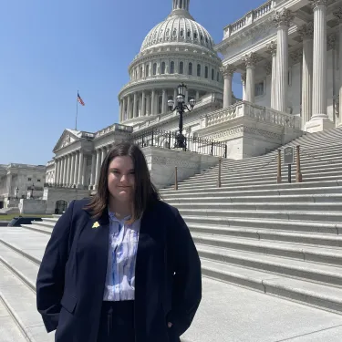 Jaden Gerard ’24 stands in front of a white capitol building