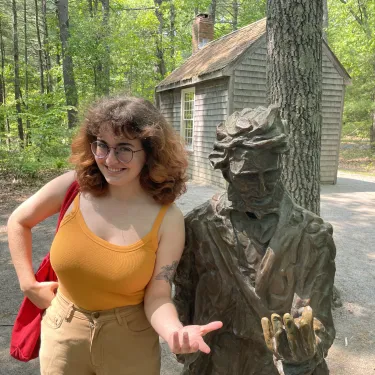 Grayson Hawthorn ’24 with a statue