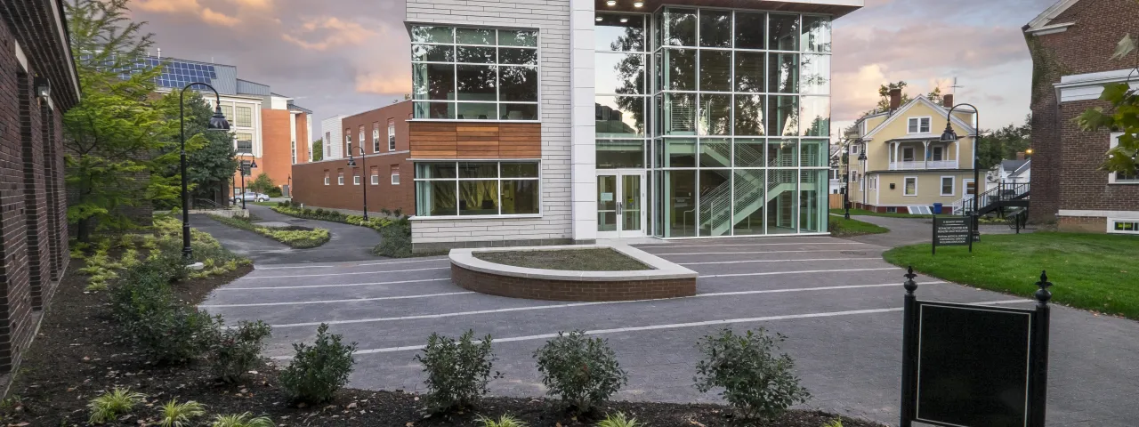 Exterior of the Schacht Center with a sunset behind it.