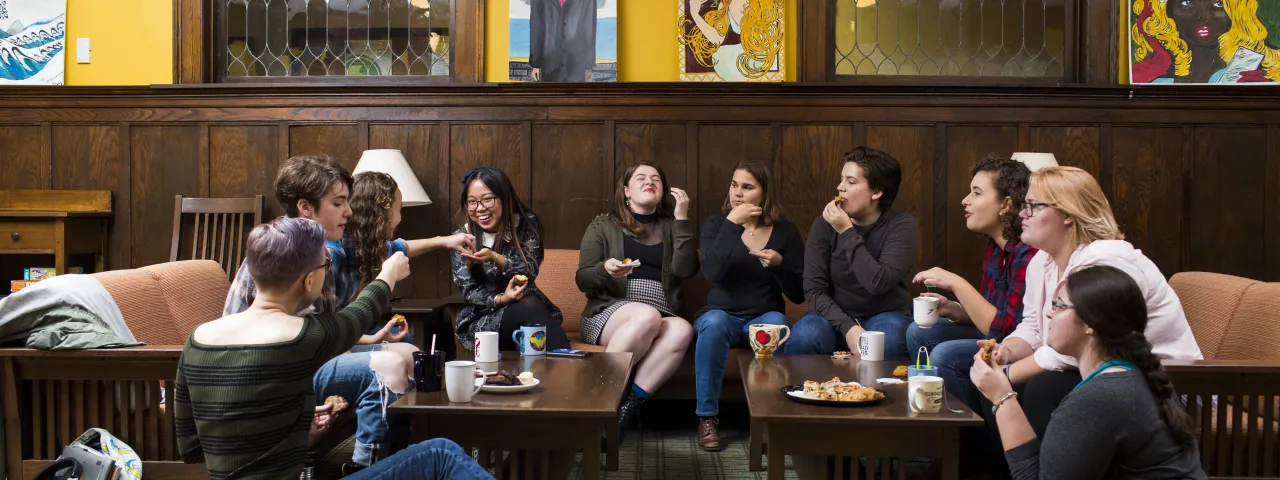 Students laughing over tea in Park House.