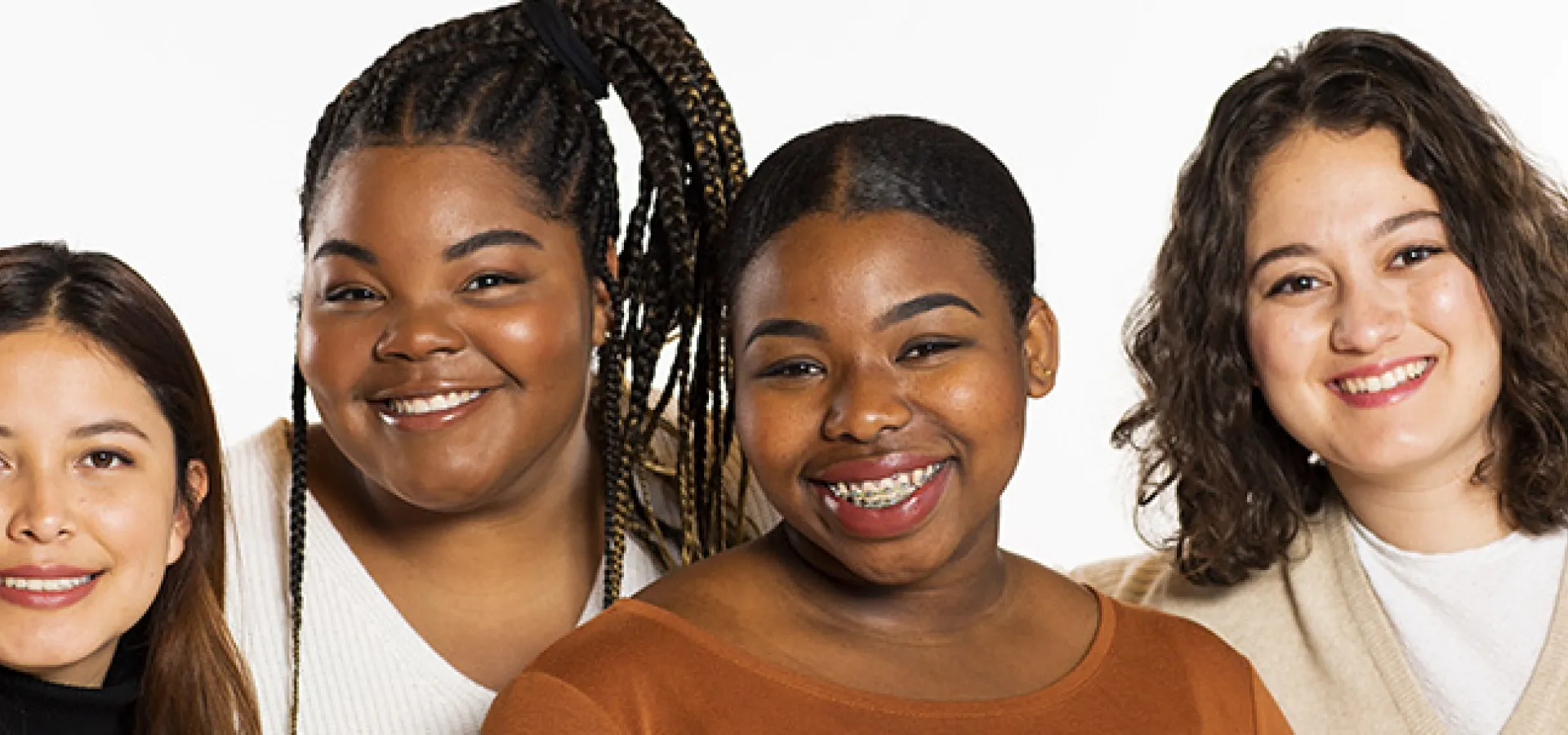 Portrait of four students on a white background