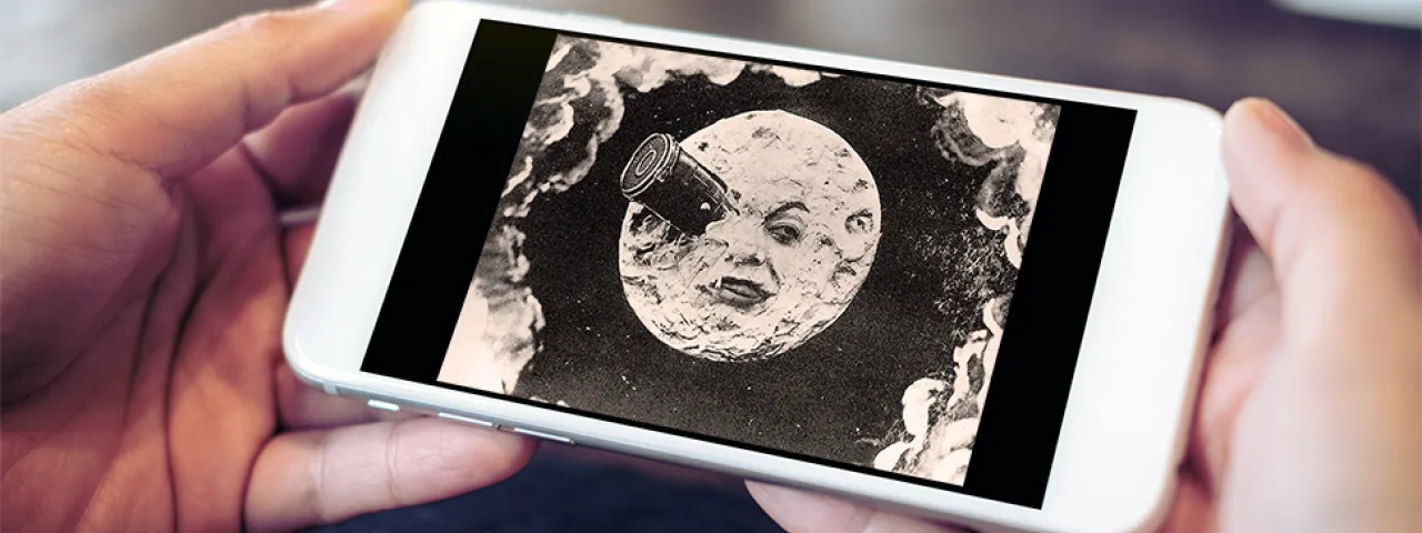 Still from the 1902 film A Trip to the Moon on a cell phone screen