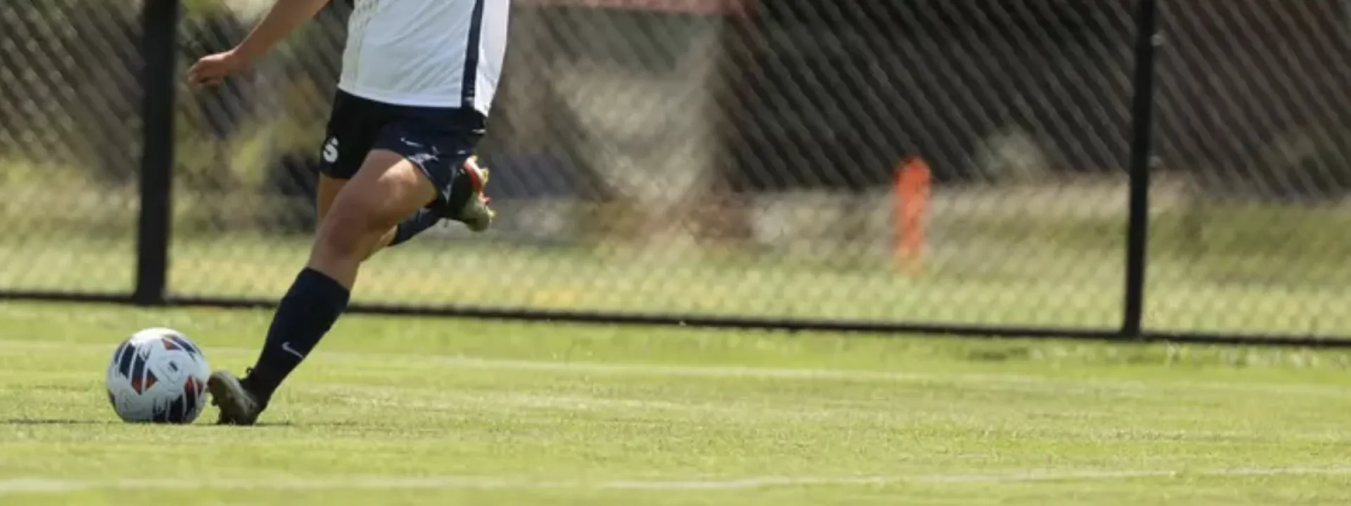 A Smith soccer player kicks the ball during a game.