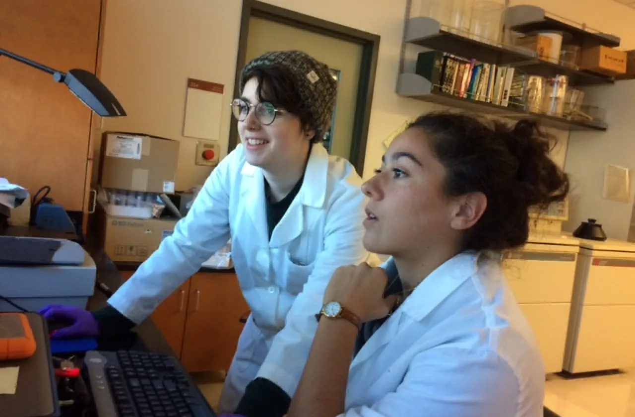 Emily Morris '19 and Maggie Pacheco '19 review data on a computer screen