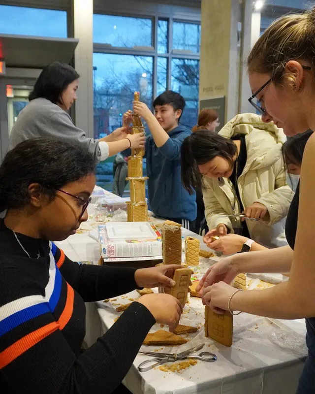 Engineering students building gingerbread skyscrapers