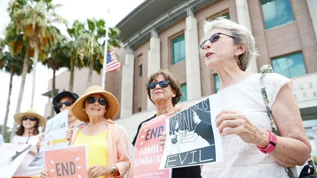 Group shot of four women protesters as part of The Angry Tias and Abuelas of the Rio Grande Valley