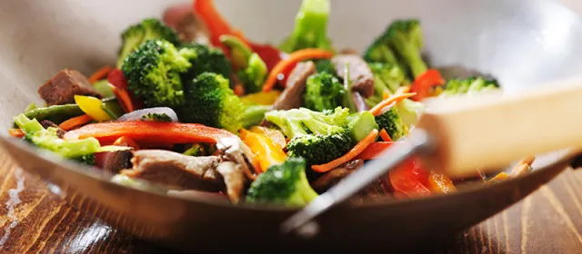 Stir-fry being prepared in a wok
