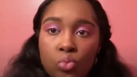 Sydney Williams video still doing a makeup tutorial in Korean