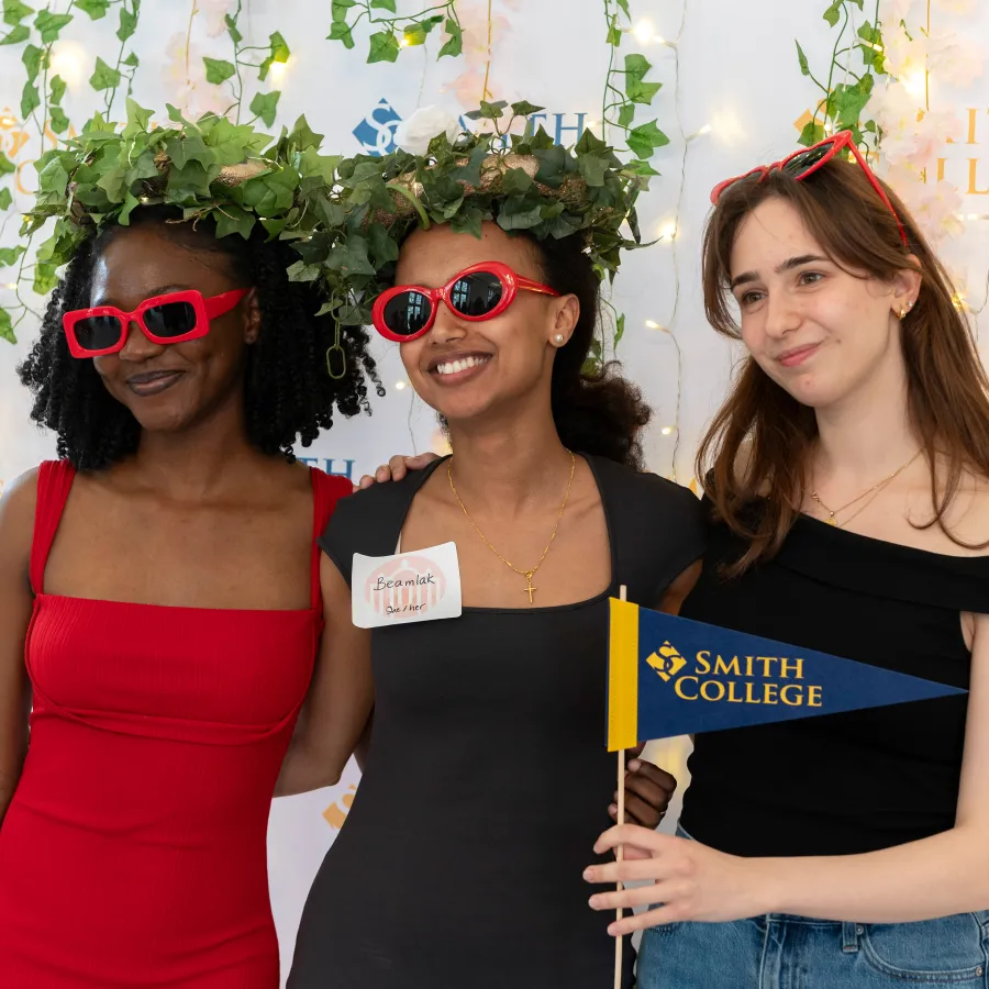 Students posing for a picture at the Senior Soiree photo booth.