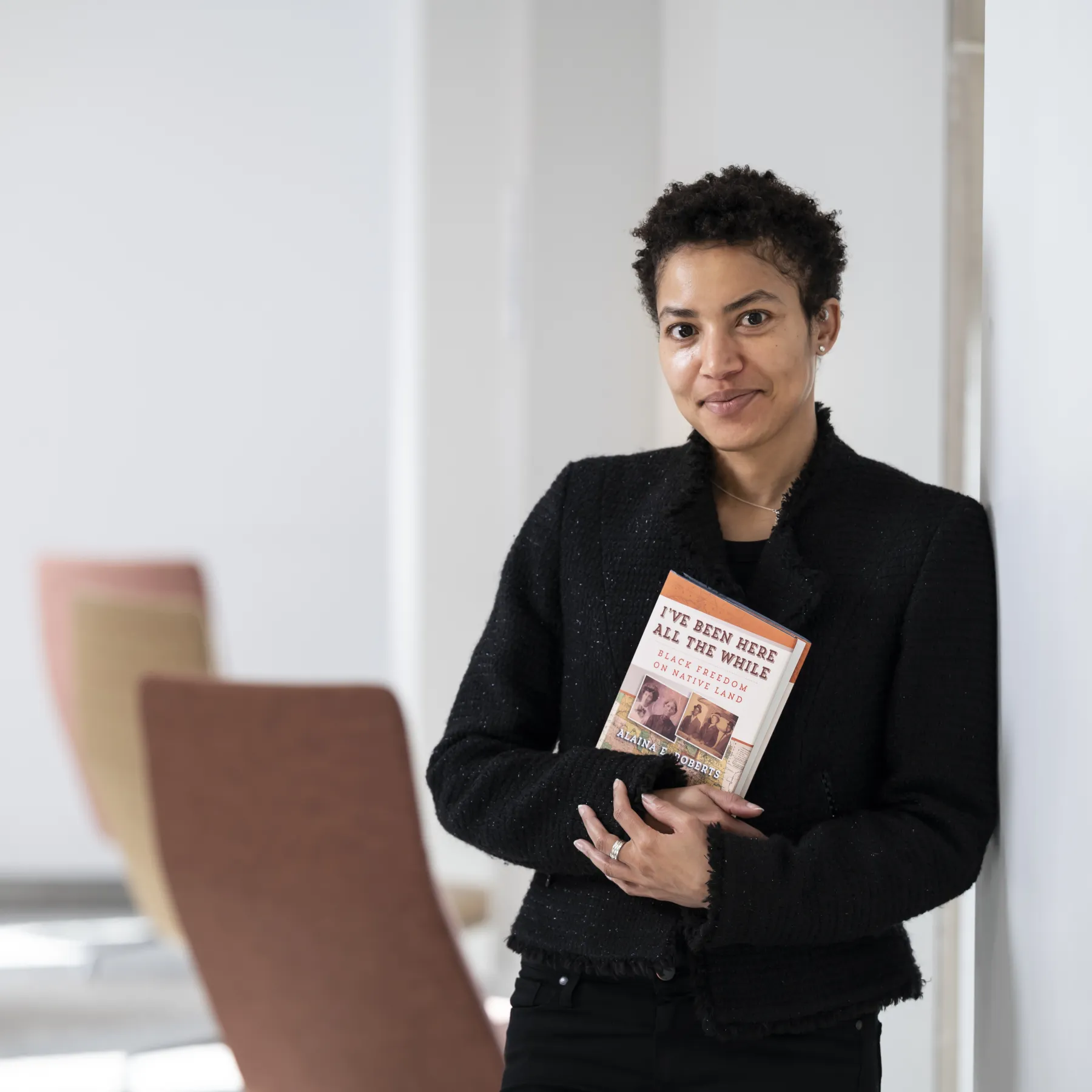 Cromwell Day speaker Alaina Roberts holds her book on Native American and Black history