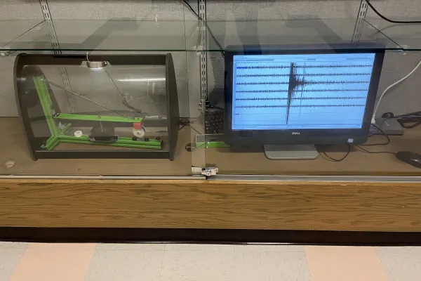 A seismometer and seismograph with evidence of the earthquake activity