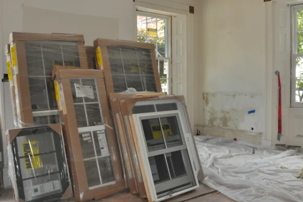 Boxes of new windows stacked up and awaiting installation