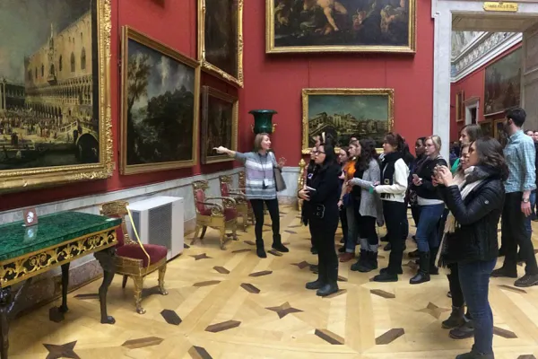 Group of students being given a tour of a museum in St. Petersburg
