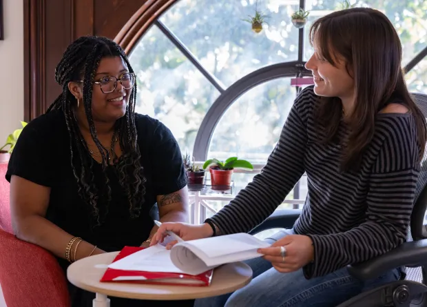 A student gets advice from a tutor in the Jacobson Center