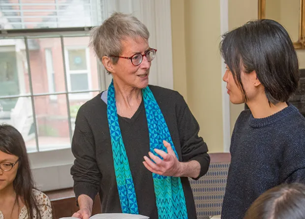 Professor speaking to two students