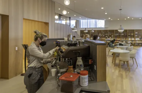 Barista making coffee in the Compass cafe.