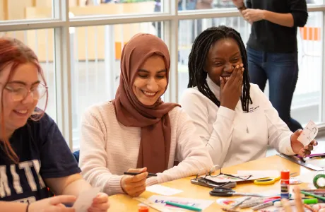 Two Smith students laugh during a workshop at ZineFest