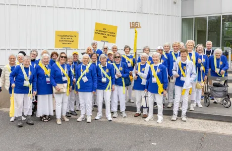 Members of the class of 1961 in matching blue sweaters before the alumnae parade
