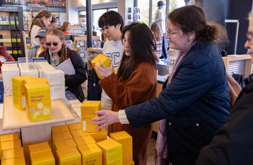 Alums peruse Smith tea at the bookstore during Come Home to Smith 2025