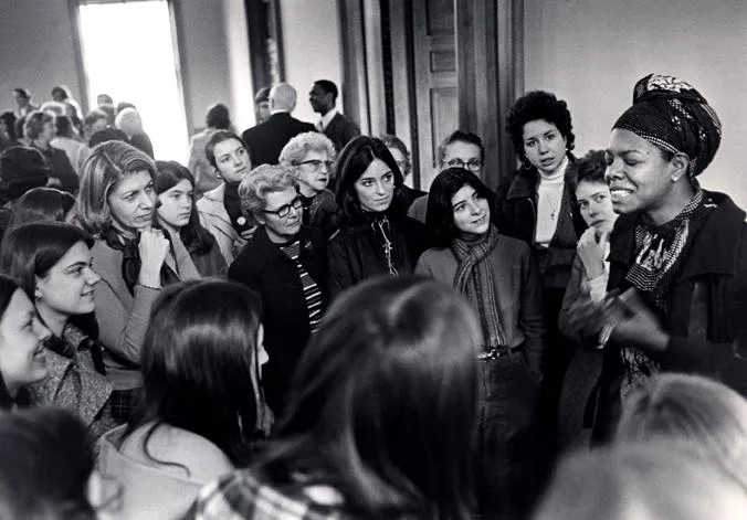A group of students listening to Maya Angelou