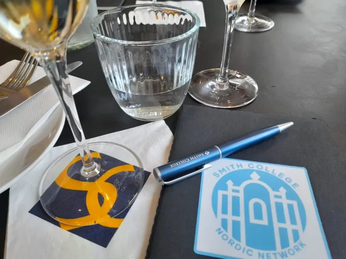 A napkin with the Smith College diamond logo on it