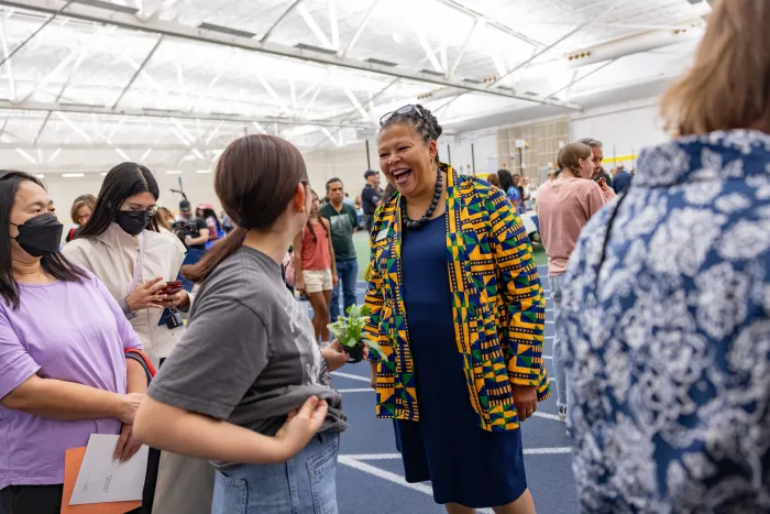 President Sarah greeting a new student during central check-in