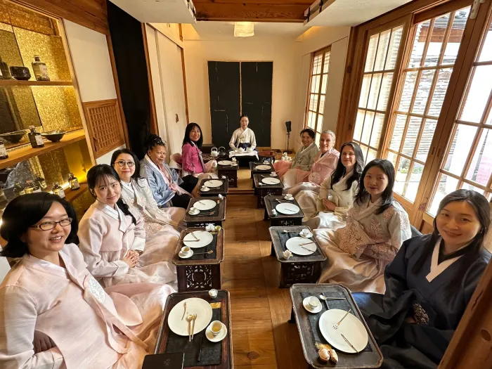 President Sarah Willie-LeBreton joins Smith College alums at a traditional Korean tea ceremony.