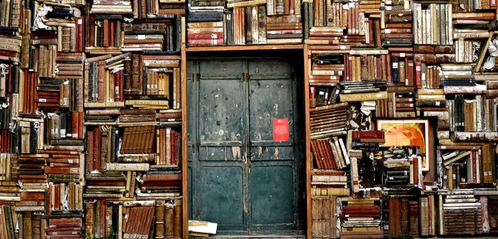 Italian doorway surrounded by stacks of books