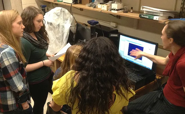 Neuroscience students reviewing data in the lab