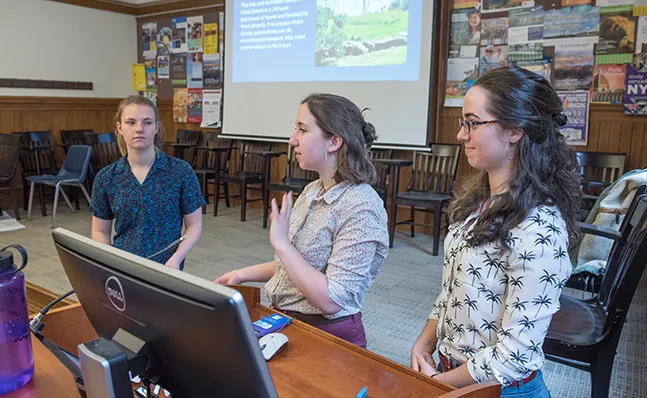 Three students giving a presentation at Celebrating Collaborations