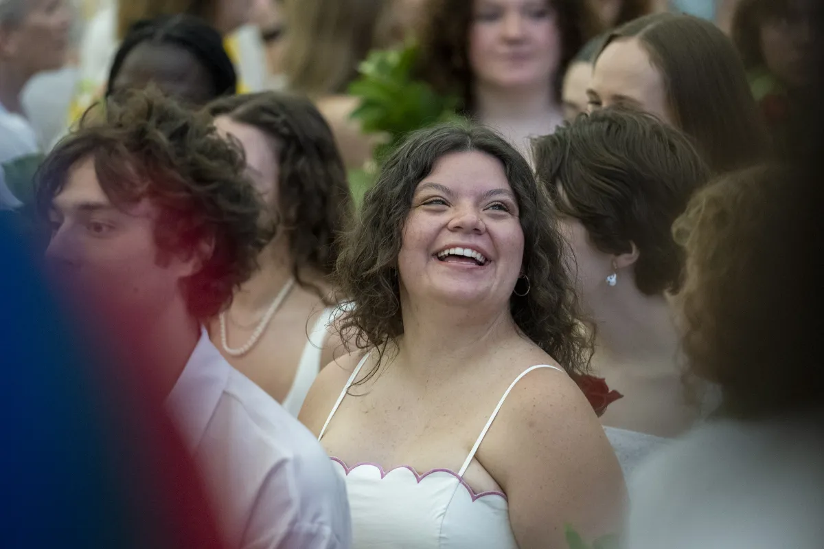A senior smiles in the crowd on Ivy Day