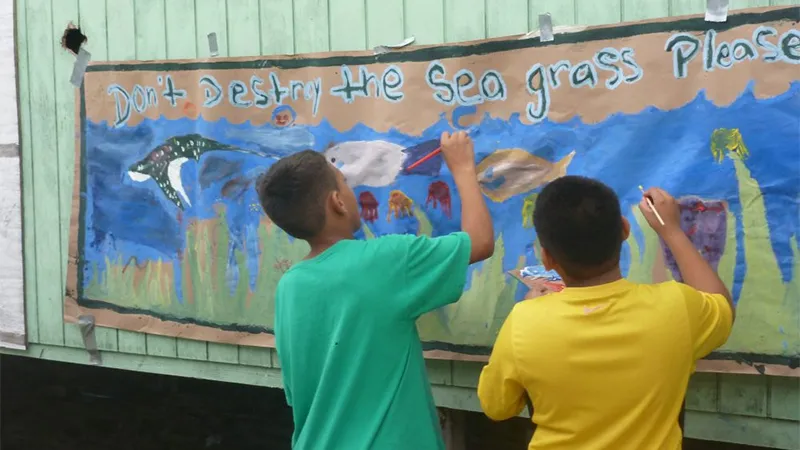 Coral Reef campers working on an educational banner