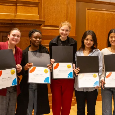 Pitch contest winners pose with their certificates.