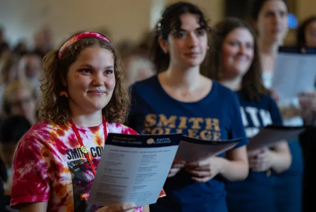 Students smiling at the President's Welcome Assembly